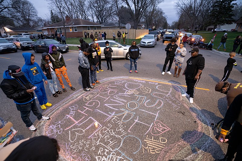 Black community members mourn Daunte Wright with a candlelight and chalk drawing vigil in Brooklyn Center, Minneapolis